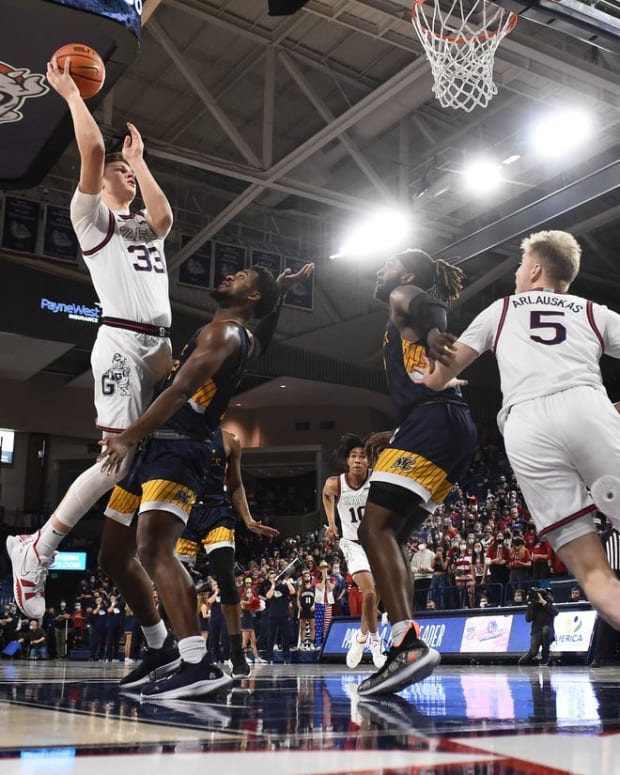Dec 9, 2021; Spokane, Washington, USA; Gonzaga Bulldogs forward Ben Gregg (33) shoots the ball against Merrimack Warriors forward Jordan Minor (22) in the second half at McCarthey Athletic Center. Gonzaga won 80-55. Mandatory Credit: James Snook-USA TODAY Sports